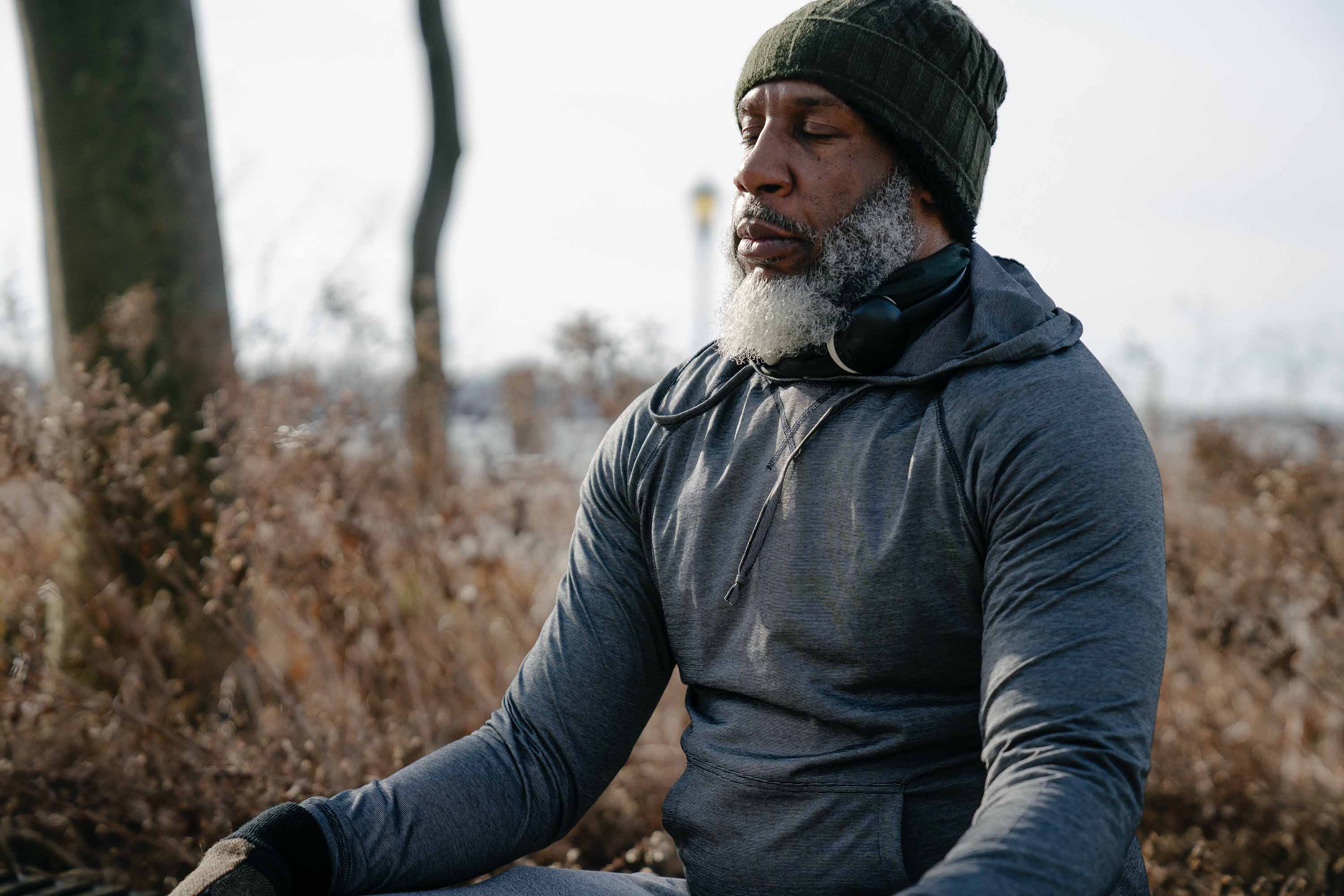 man sitting down meditating